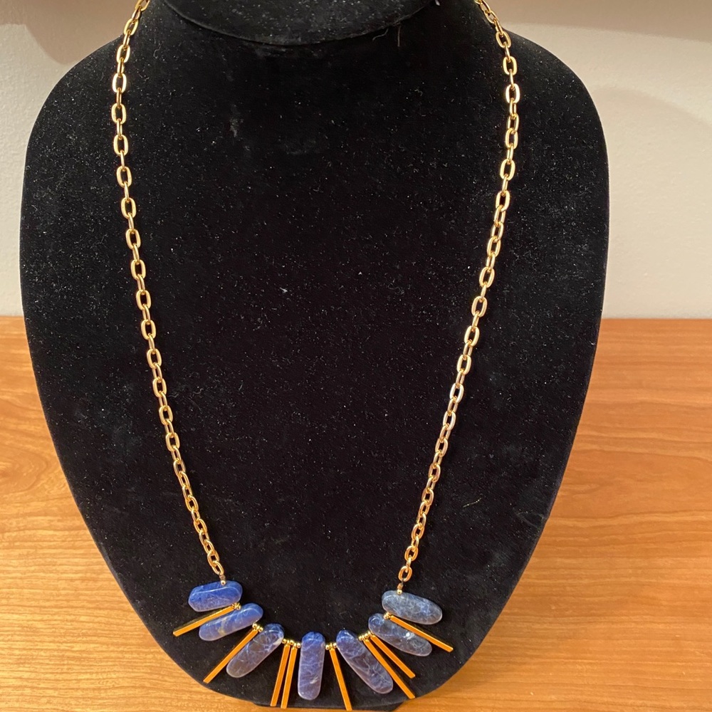 Gemma Redux gold tone necklace with blue “stones”